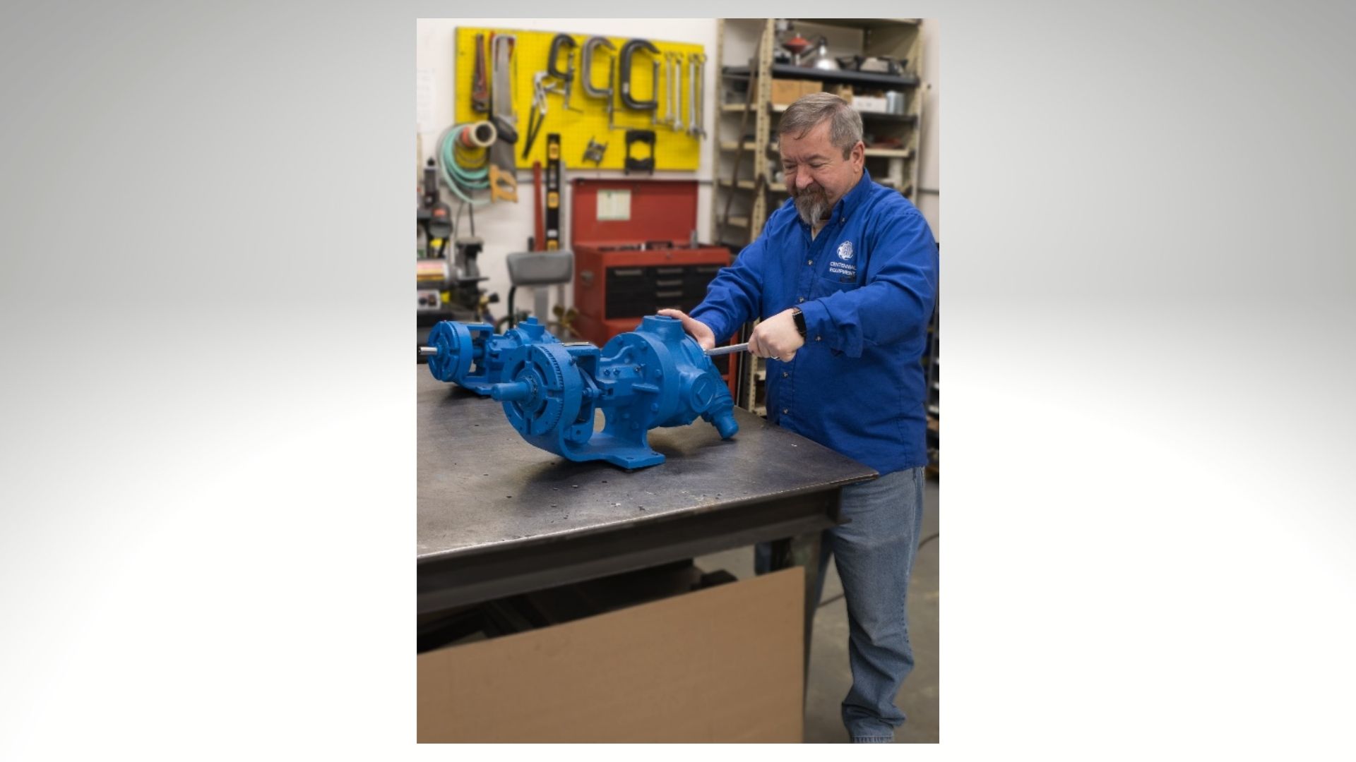 Centennial employee working on a pump