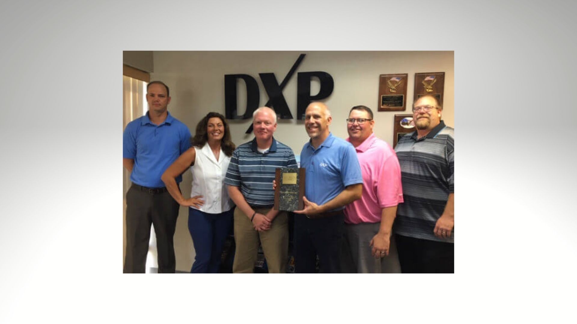 DXP staff receiving award