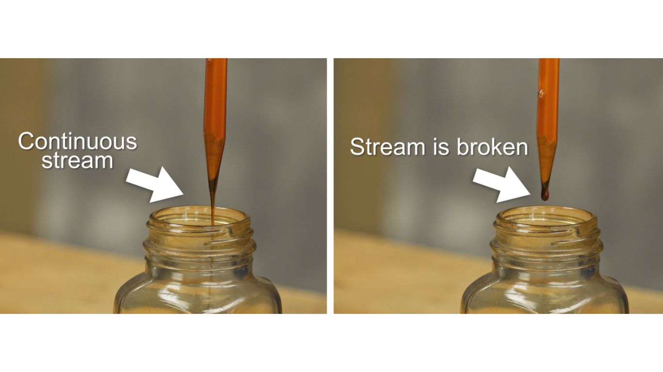 STEP 4: Liquid will flow along the pencil and into the container as a continuous stream. When the stream breaks and droplets form, stop the timer.