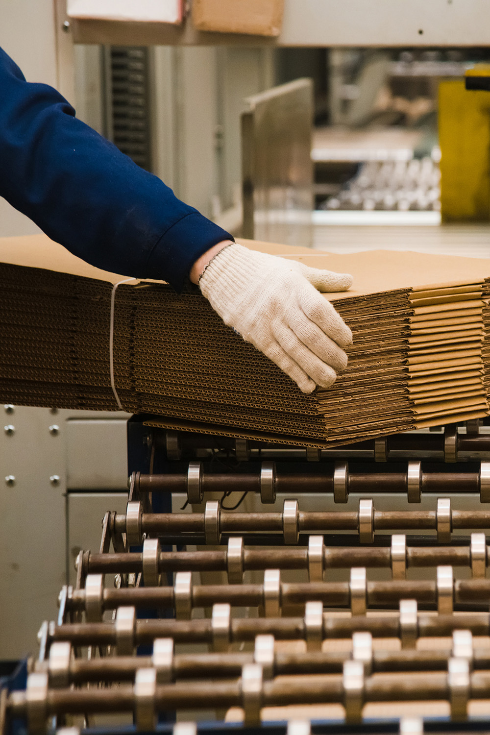 a package of corrugated boxes moving down a factory line