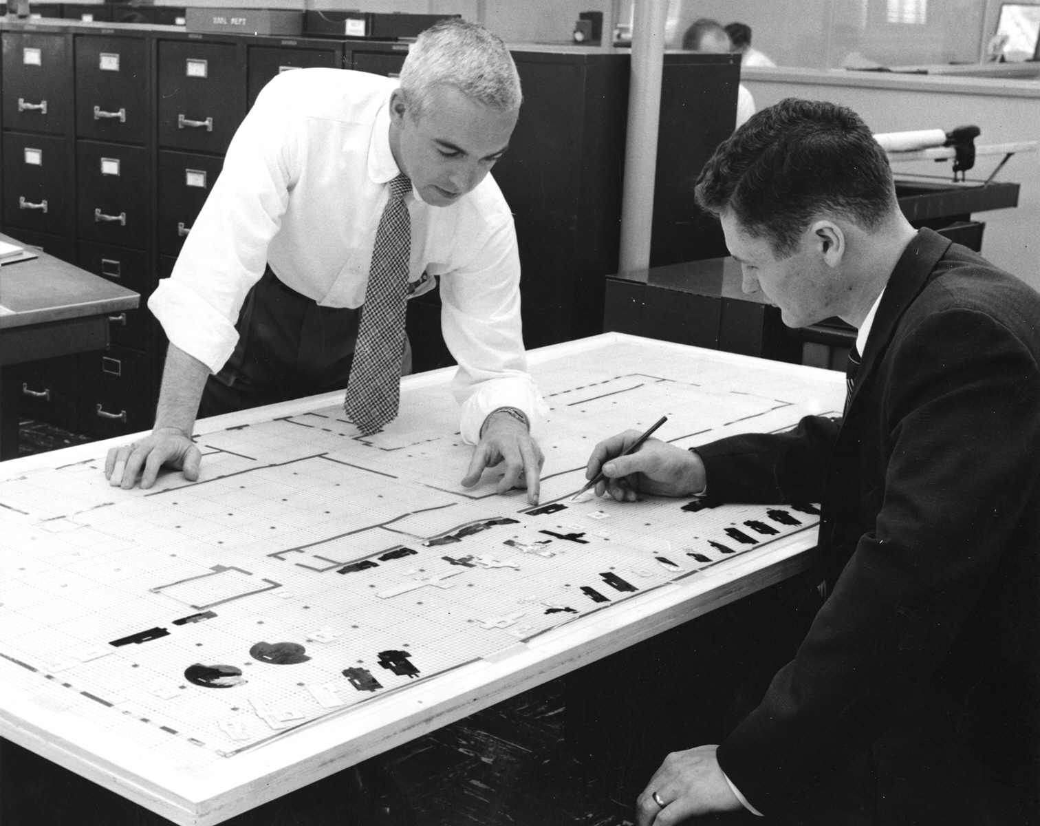 vintage photo of engineering review hand-drawn blueprints