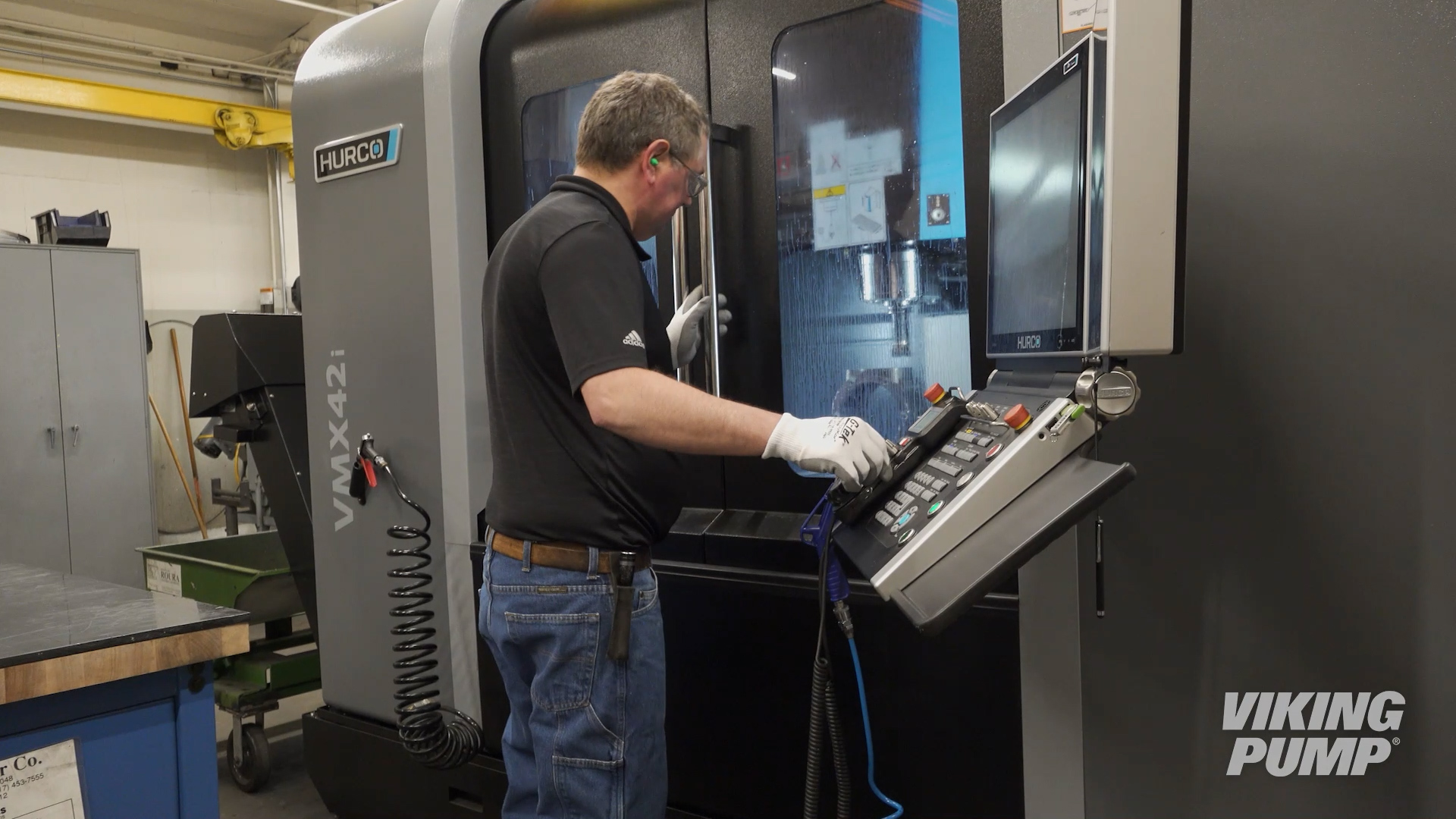 product engineering lab worker using vertical machining center