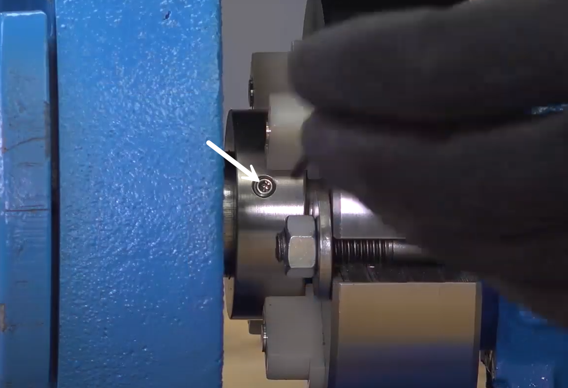Evenly tighten the seal sleeve set screws to set the collar to the shaft