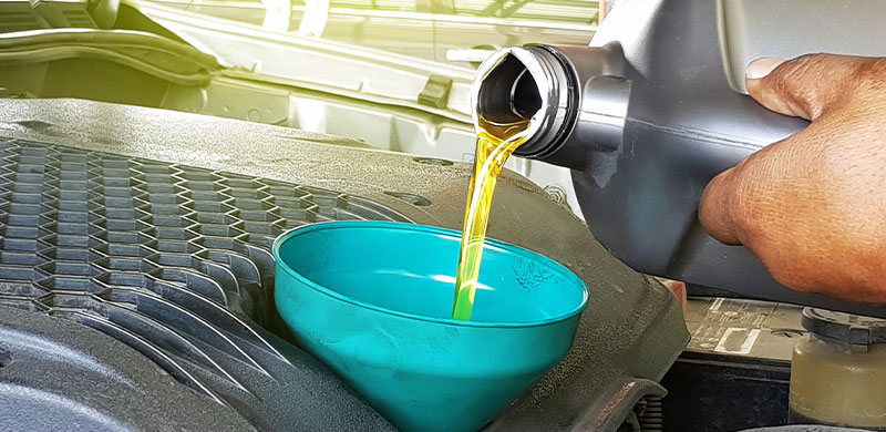 Oil being poured into vehicle