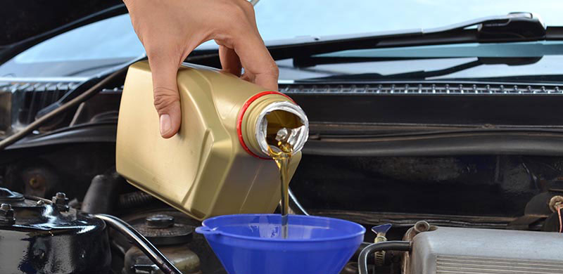 Oil being poured into vehicle