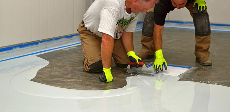 Resin being applied to floor