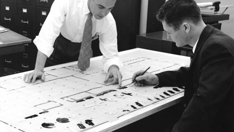 vintage photo of engineering review hand-drawn blueprints
