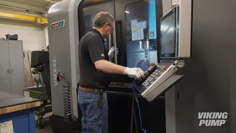 product engineering lab worker using vertical machining center