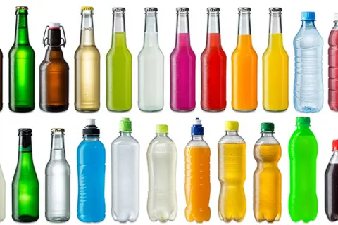Two rows of various beverage bottles