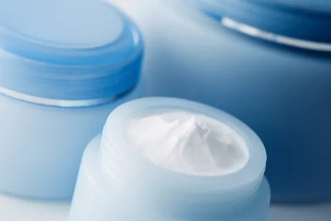 Containers of cosmetic cream