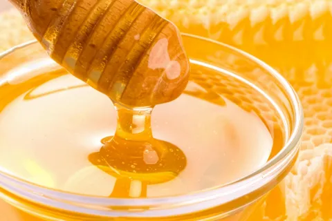 Honey flowing off a honeycomb