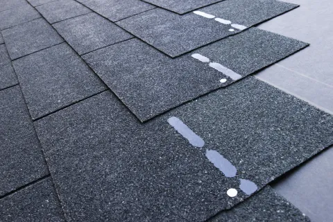 Close up of asphalt tiles on roof