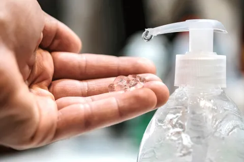 Hand sanitizer being pumped onto a hand
