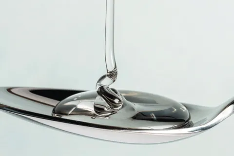 Pectin gel being poured onto spoon