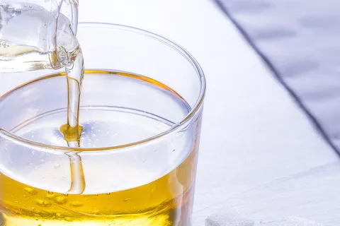 Liquid sugar solution being poured into a glass