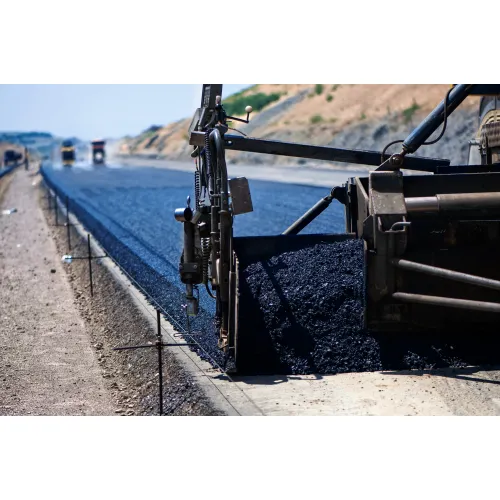 road spreader spreading asphalt