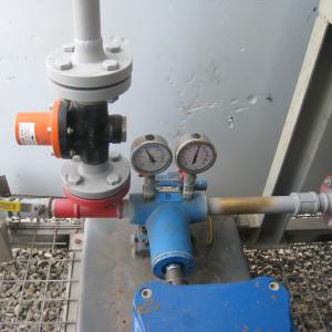 image of a pump with inlet and outlet gauge